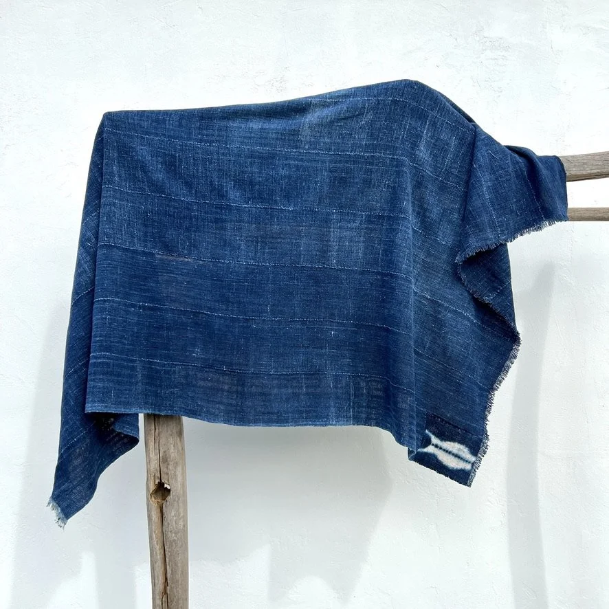 indigo cloth fish patch visibly mended hanging sideway
