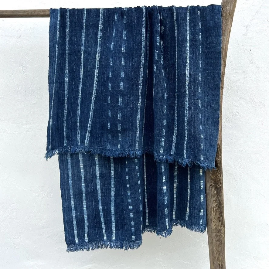 Vintage indigo cloth Mali resist-dyed dots and stripes hanging closeup