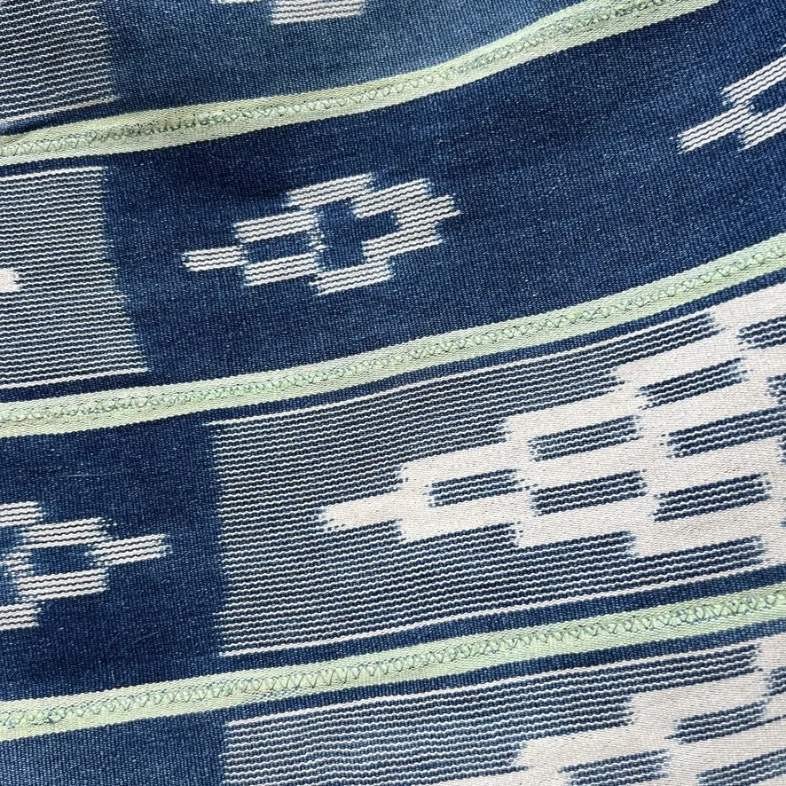 Baoulé blanket green stripes visibly mended closeup 1