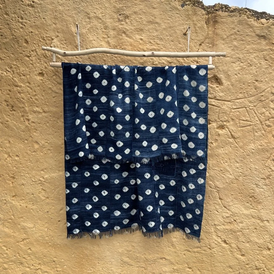 Indigo cloth dark blue cowrie shells visibly mended