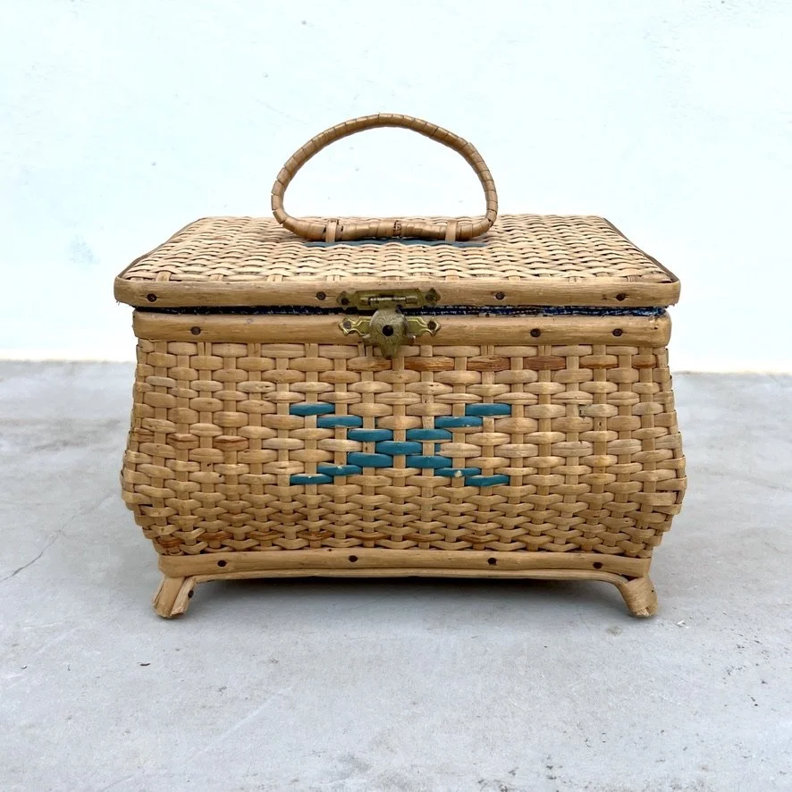 small vintage rattan sewing basket with sewing accessories front