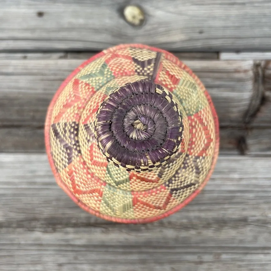 Vintage Ethiopian pedestal basket with lid top view