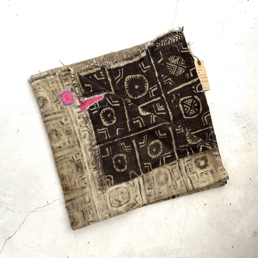 Visibly mended Mali mud cloth folded