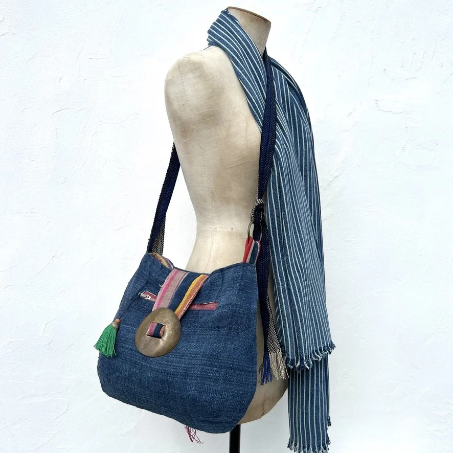 Reversible cross-body bag ethnic textiles on model 1