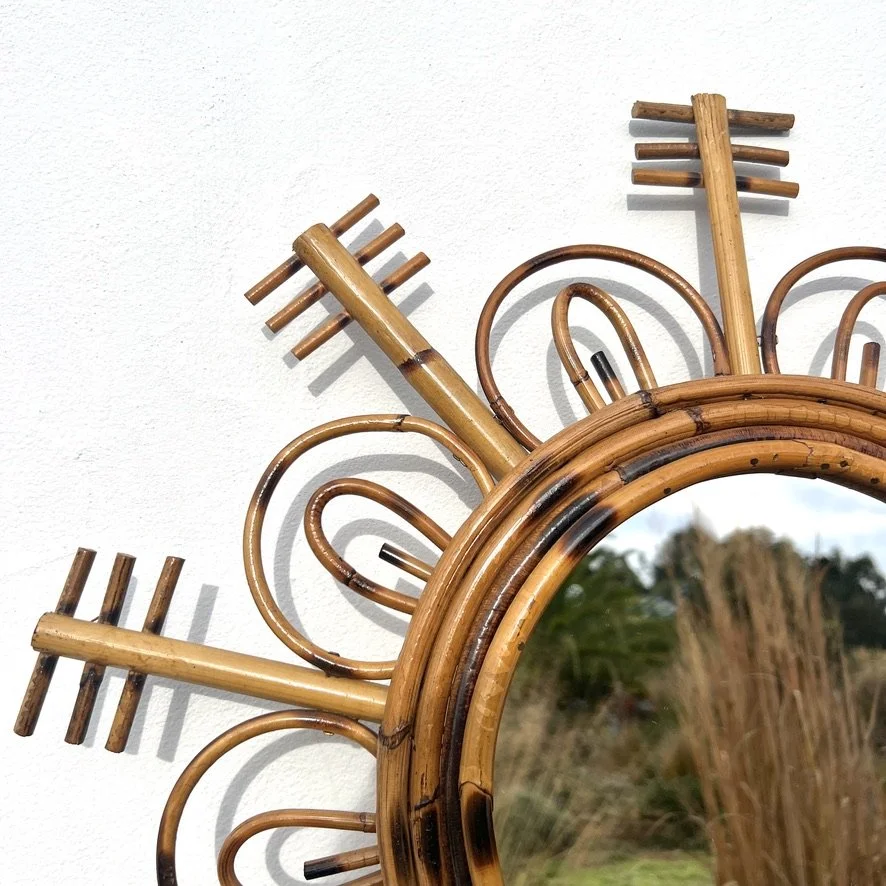 Vintage rattan sun mirror closeup