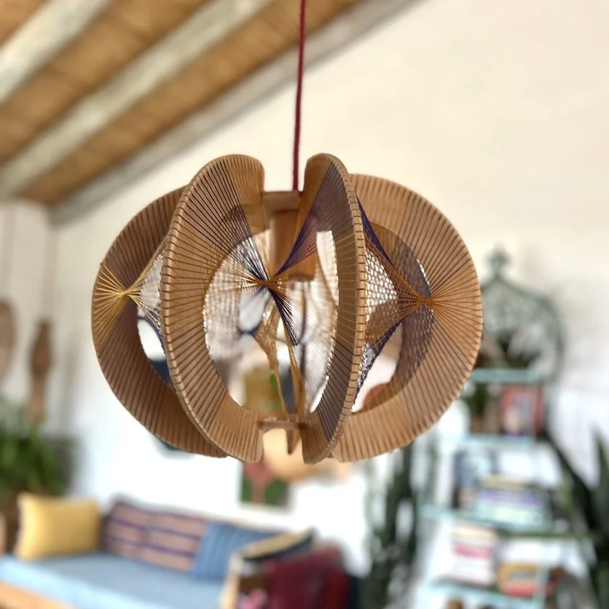 plywood string pendant lamp hanging inside