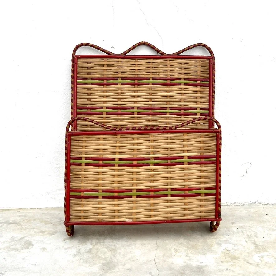 Vintage rattan document holder propped up