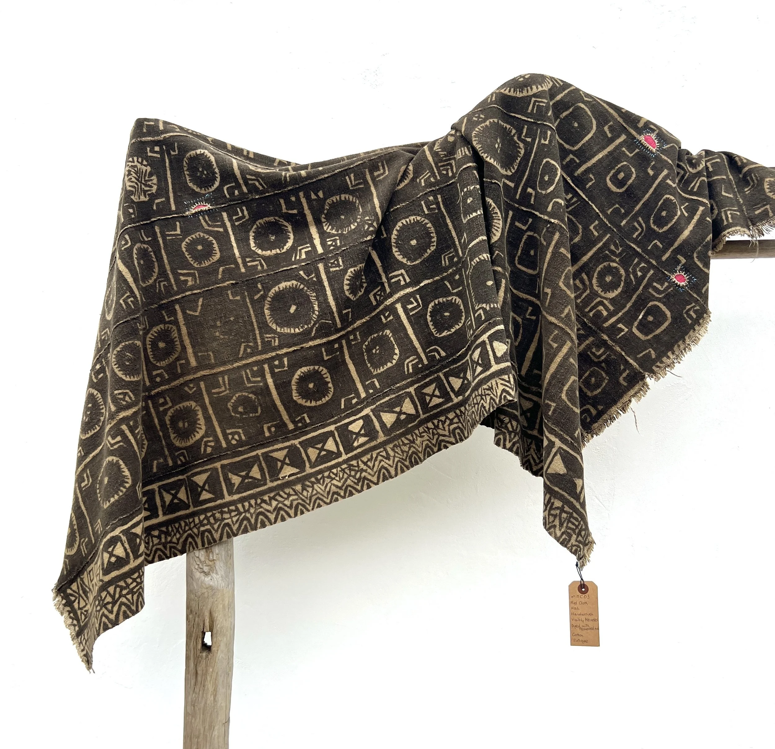 Visibly mended Mali mud cloth hanging