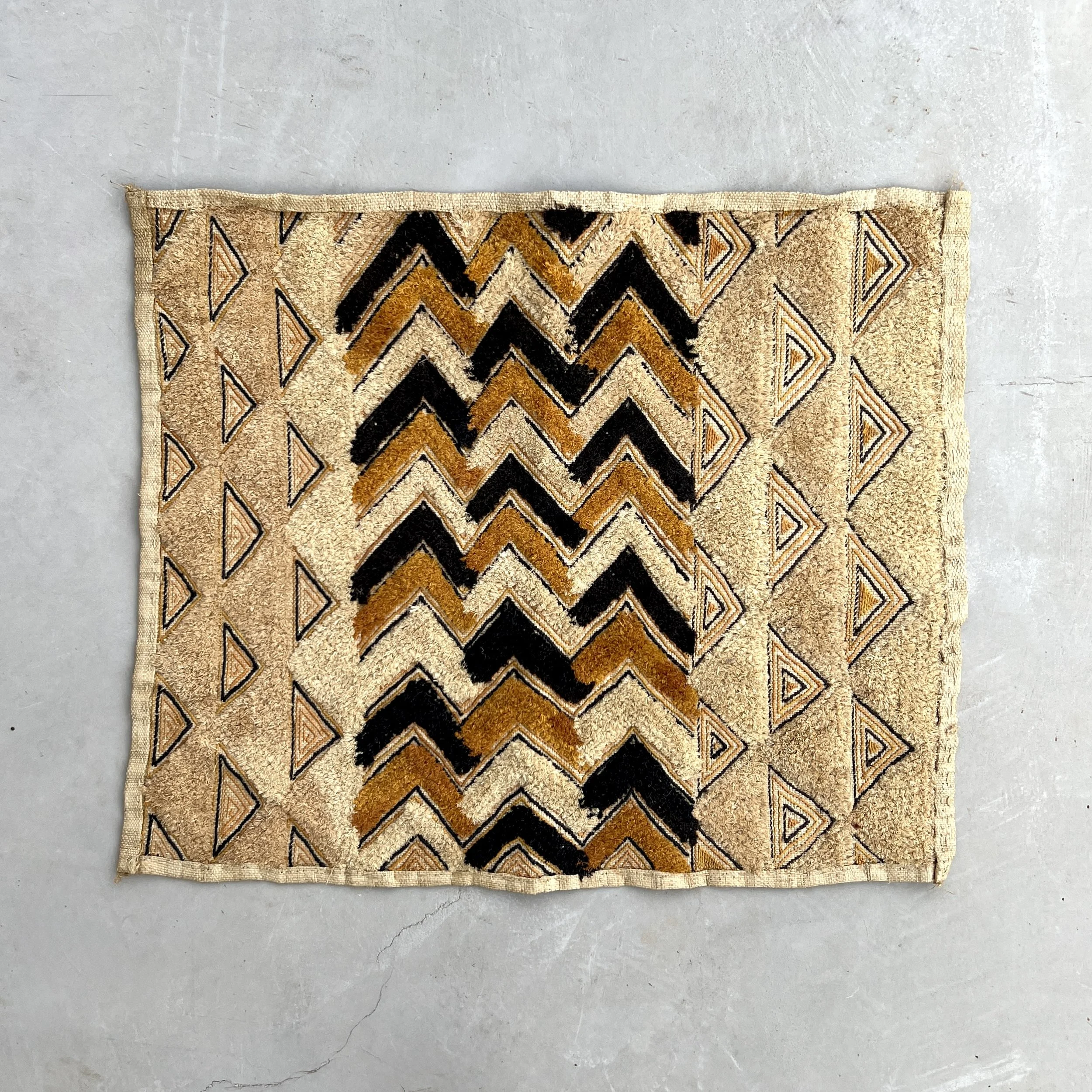 Kuba cloth pile triangles front