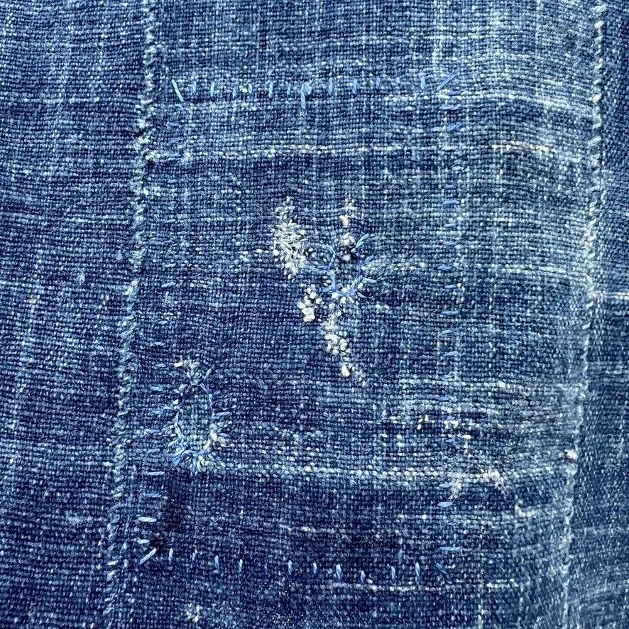 indigo mossi scarf visibly mended closeup patch