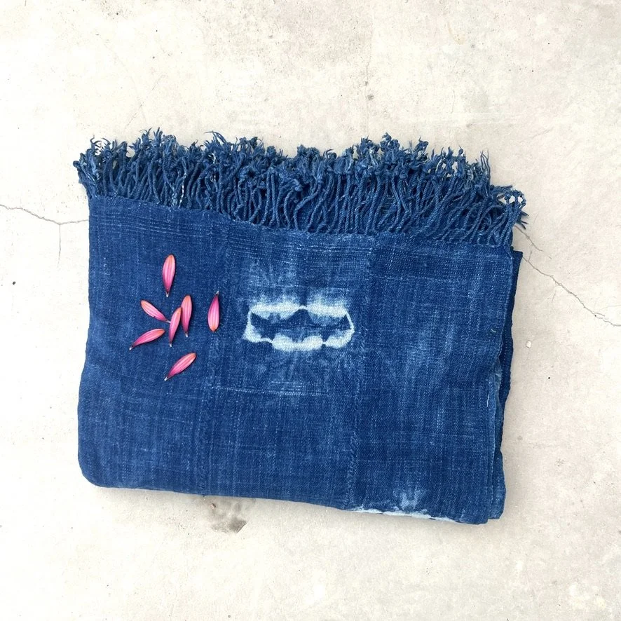 large indigo textile resist-dye with fringe folded