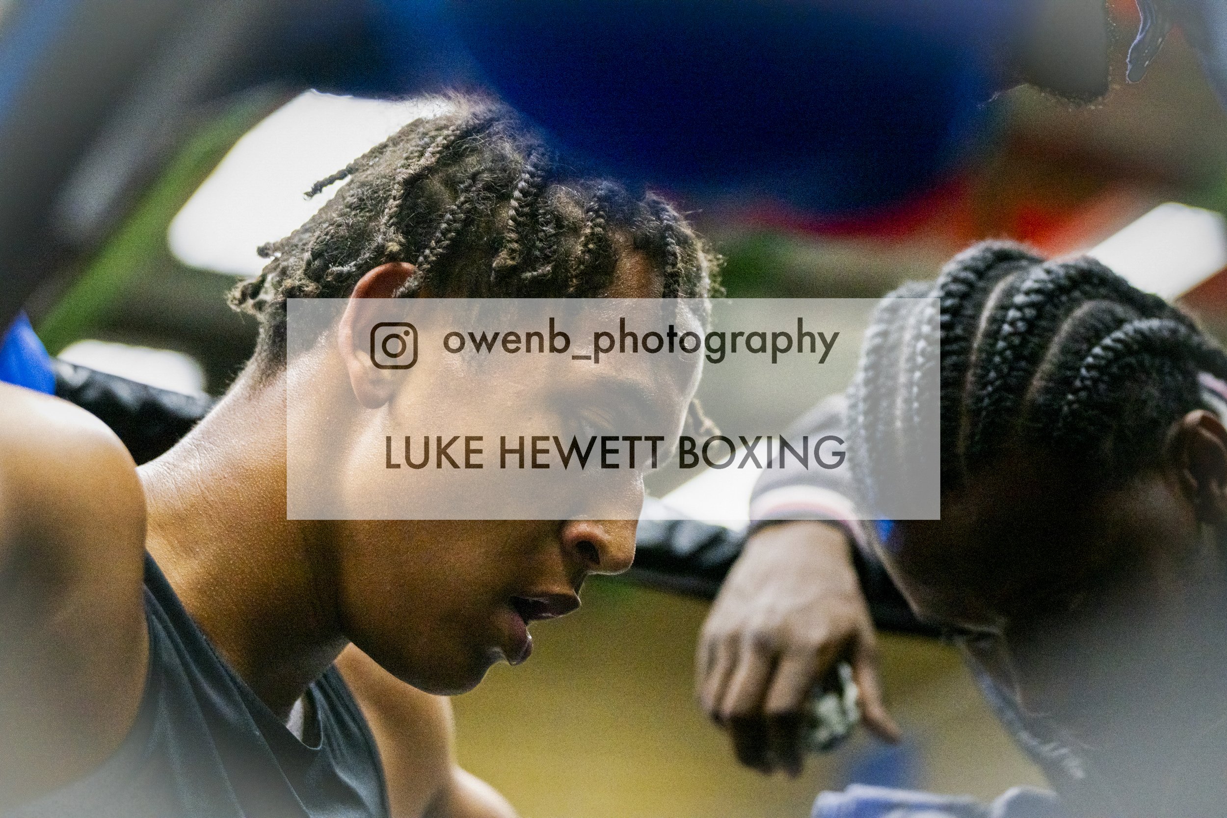 Young boxer, Luke Hewett, with dreadlocks, preparing for a match in a gym, accompanied by his coach.