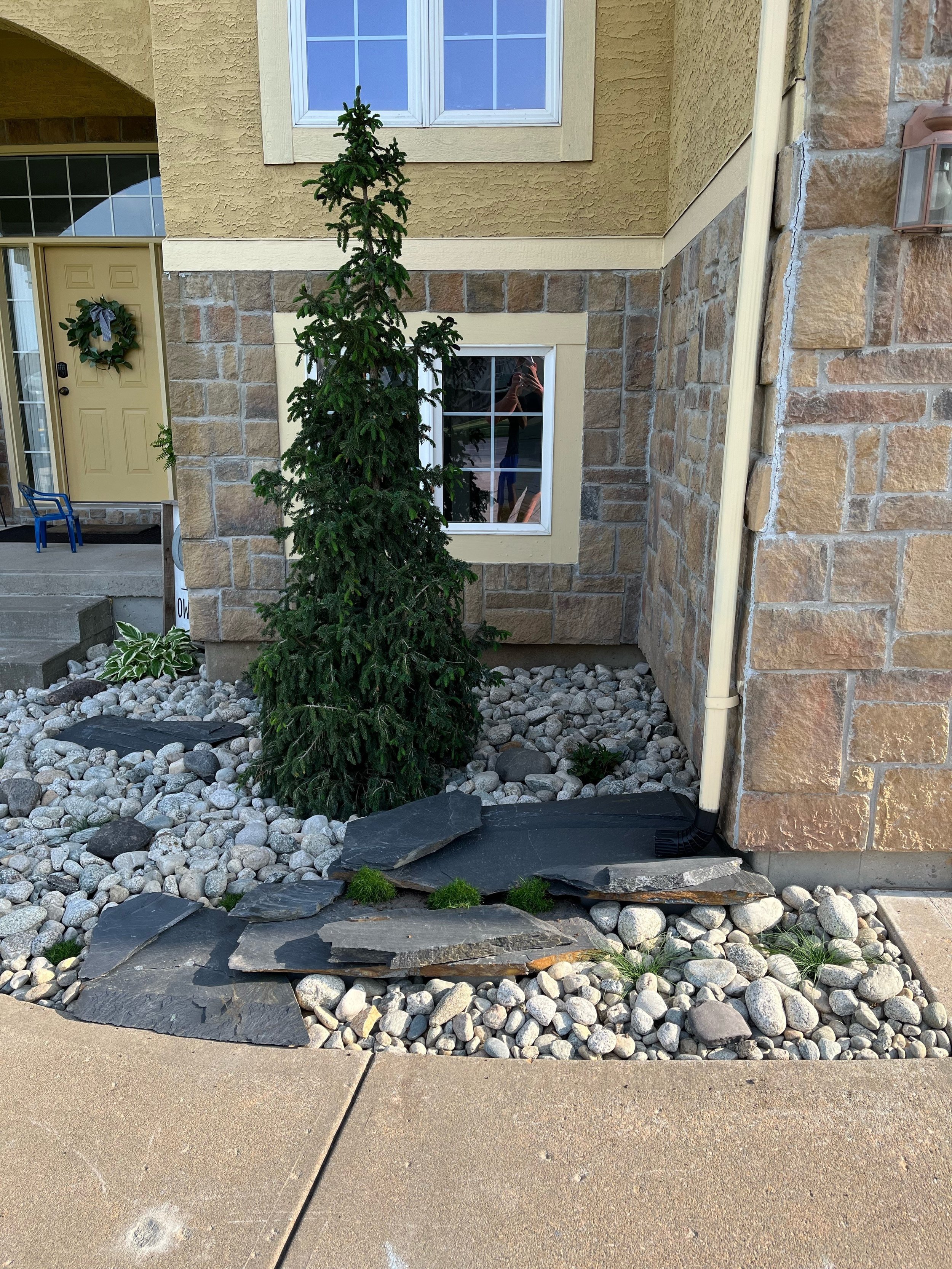 CO Salt & Pepper 2-4" and 1" Irregular Midnight Slate Pieces to make a small down-spout waterfall in order to direct the water away from the foundation.