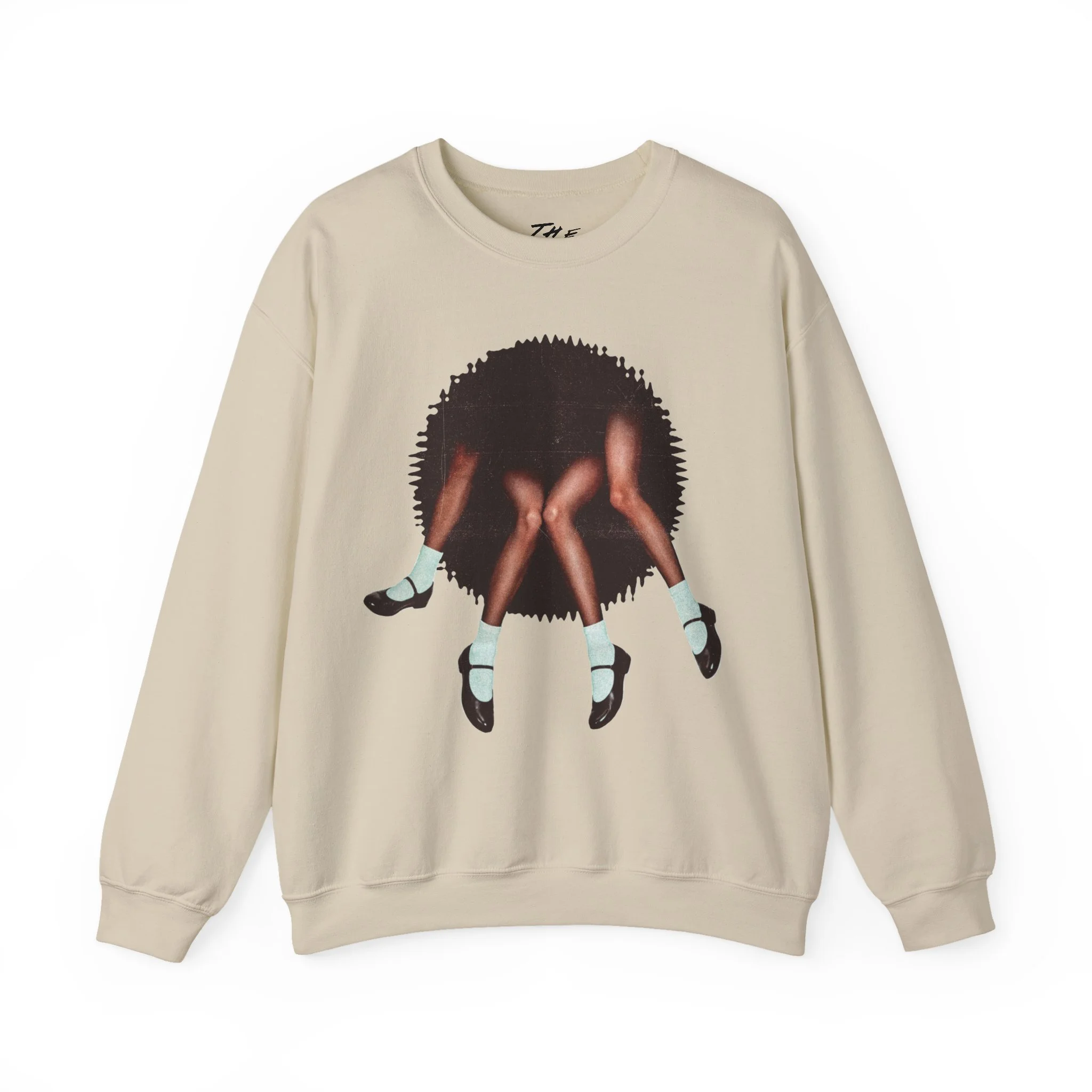 A unisex heavy blend crewneck sweatshirt featuring a surrealist retro collage design of legs wearing vintage Mary Jane shoes on a textured mixed-media background.