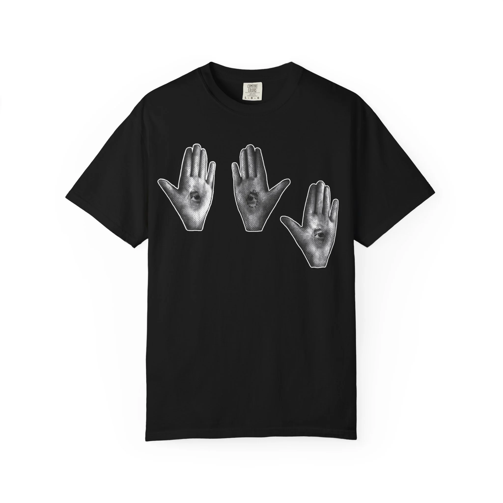 A product photo of an alternative unisex t-shirt featuring a surrealist black and white collage graphic of a mystic hand with open eyes embedded in the palm.