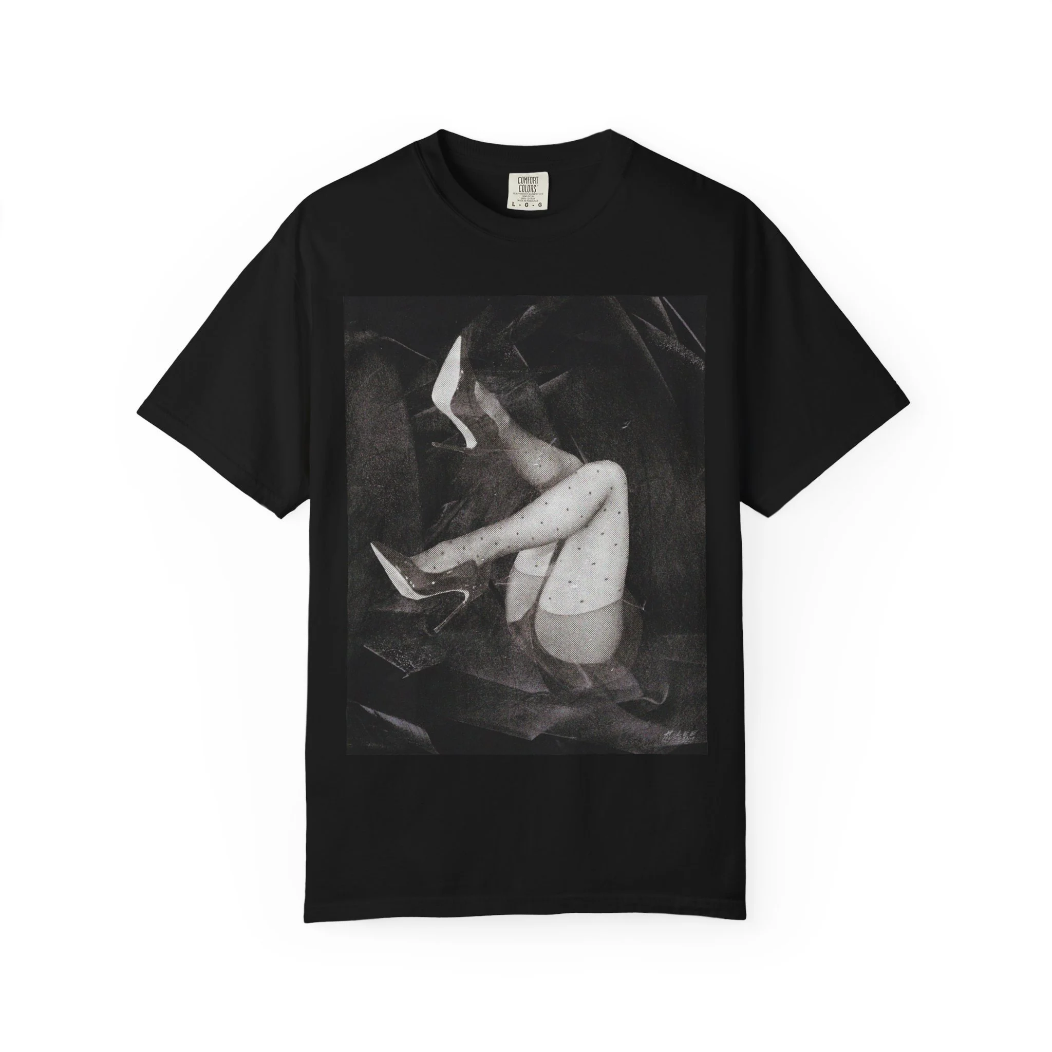 A lifestyle product shot of a unisex streetwear t-shirt printed with a high-contrast black and white surrealist collage of halftone female legs in polka dot stockings and high heels.