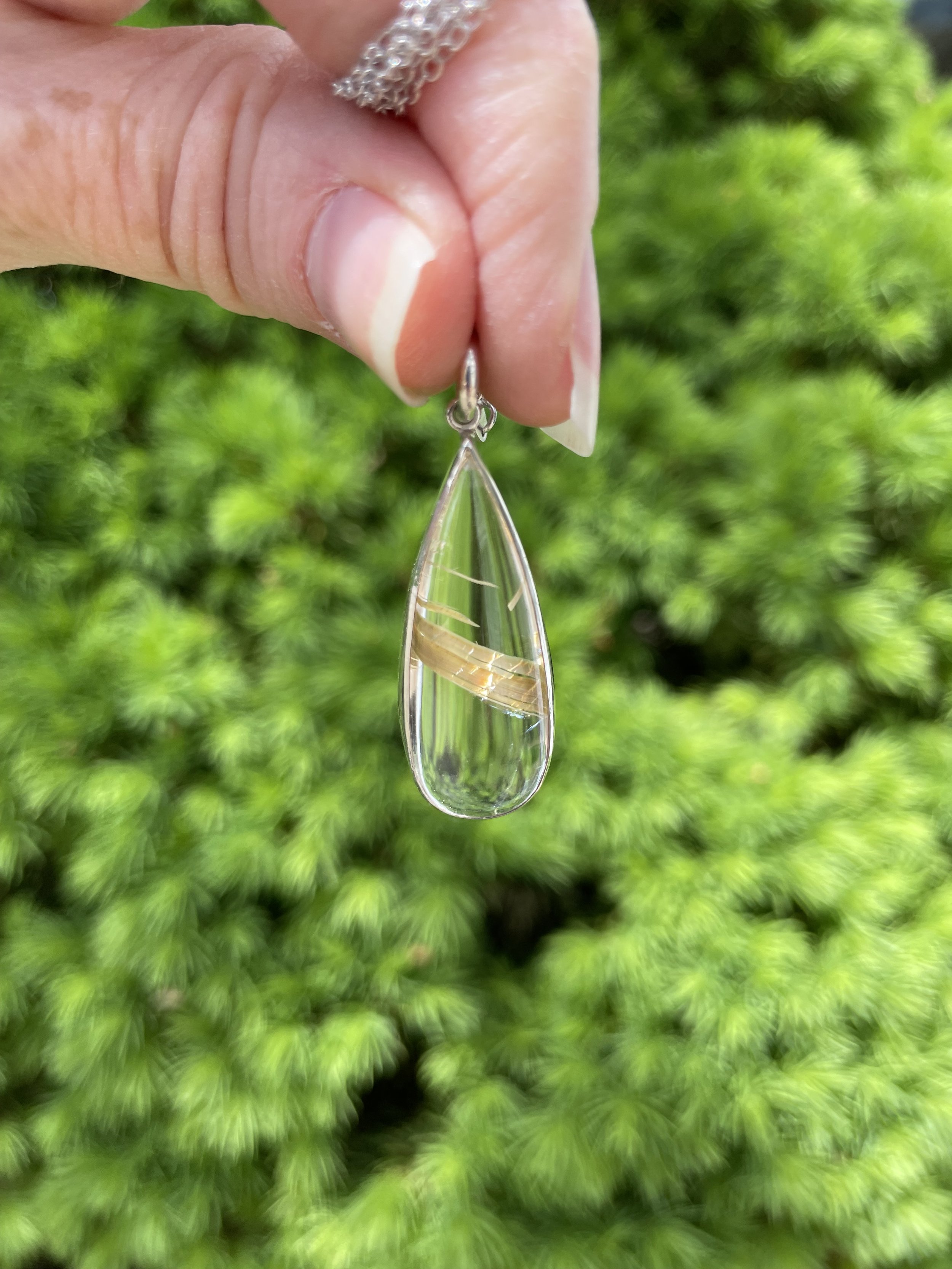 Gold rutilated quartz teardrop pendant .jpeg