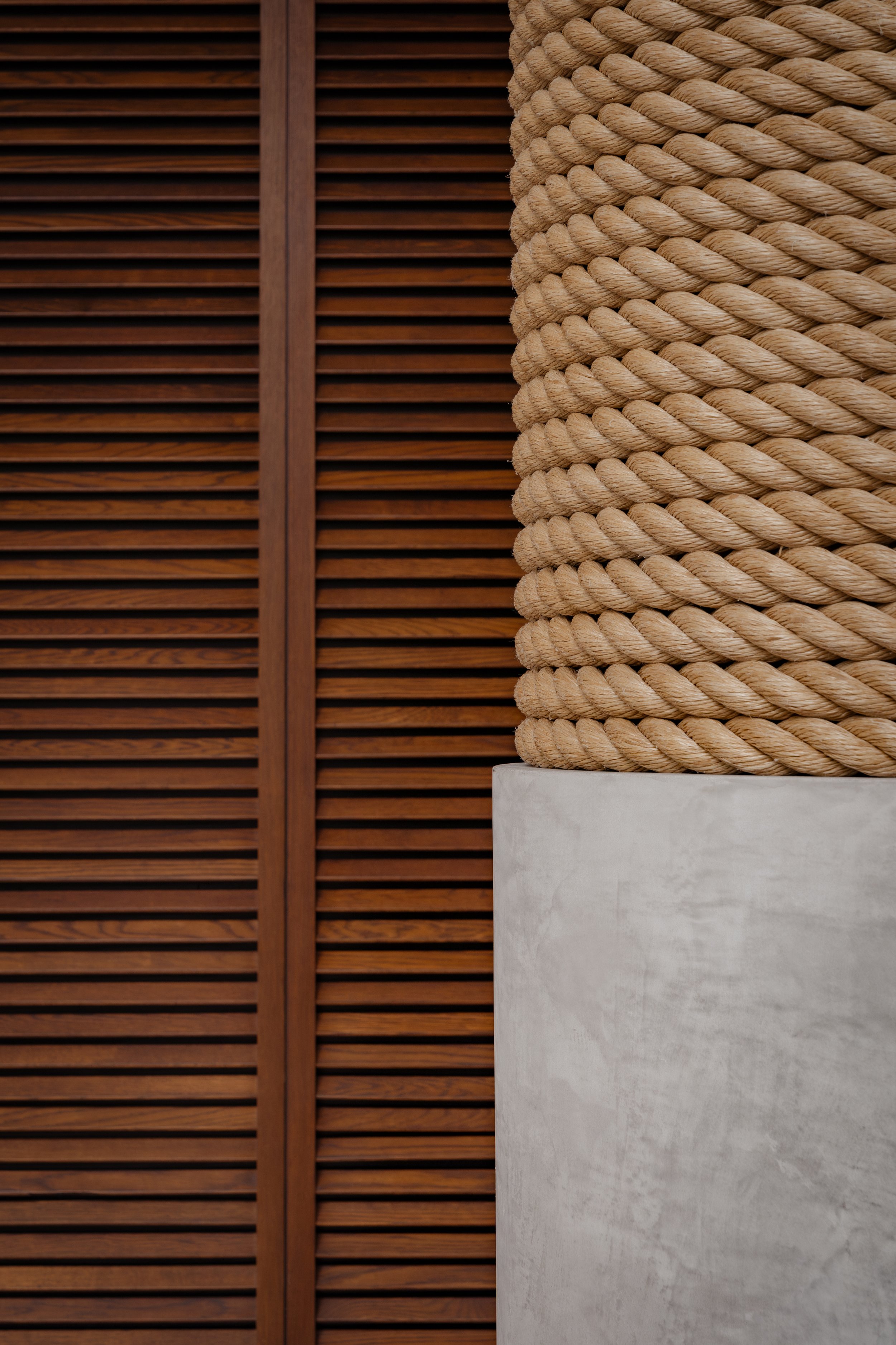 Interior details of lobby space at Bella Isla Luxury Apartments featuring custom fabrications, luxury finishes, and millwork by McKenzie Craft, located in Miami, Florida.