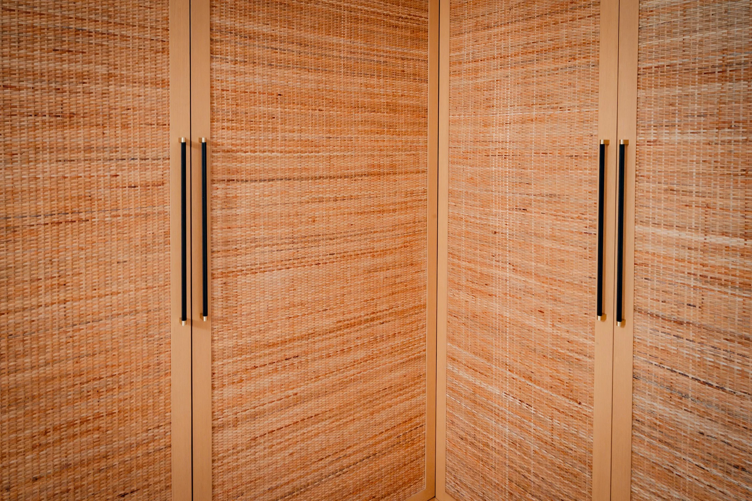 Custom closet in Miami Beach Condo by McKenzie Craft, a custom fabrication millwork metalwork company.