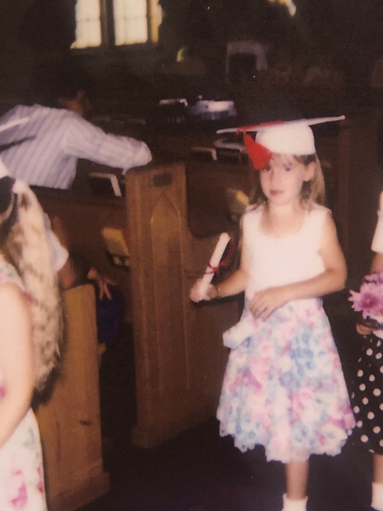 Elementary-aged Ashley Ehasz at graduation