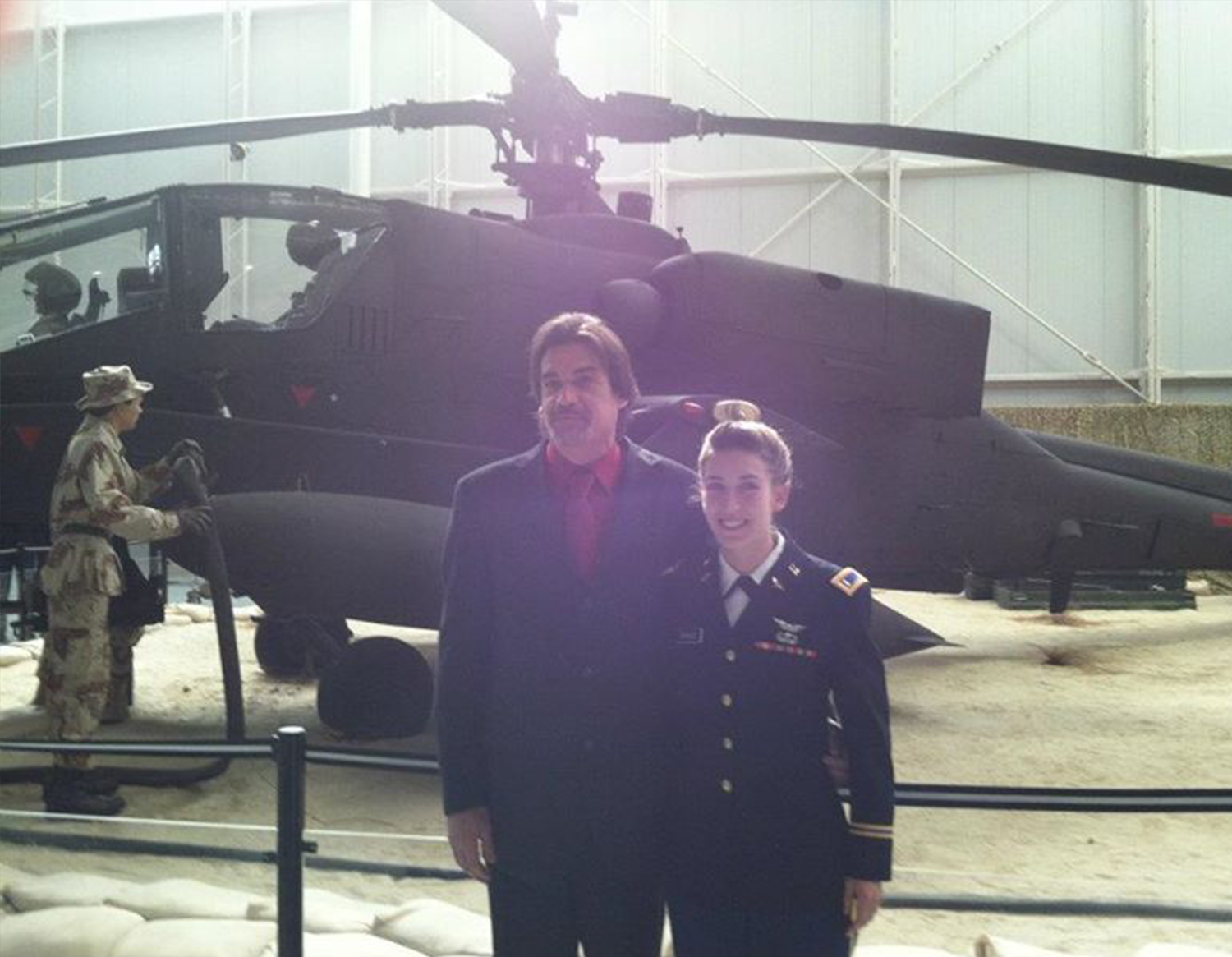 Ashley in uniform with father at flight school graduation
