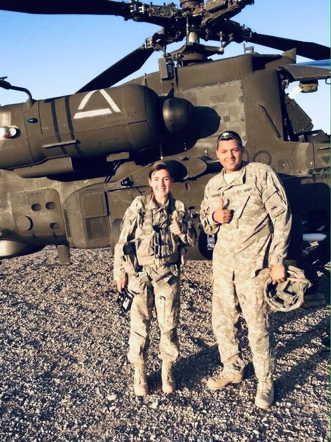 Ashley in uniform and solider in front of chopper