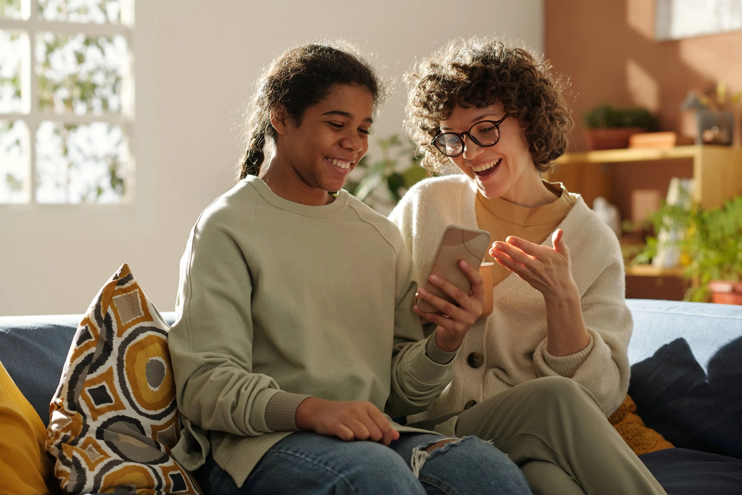 Foster parent shares a laugh with a foster youth.