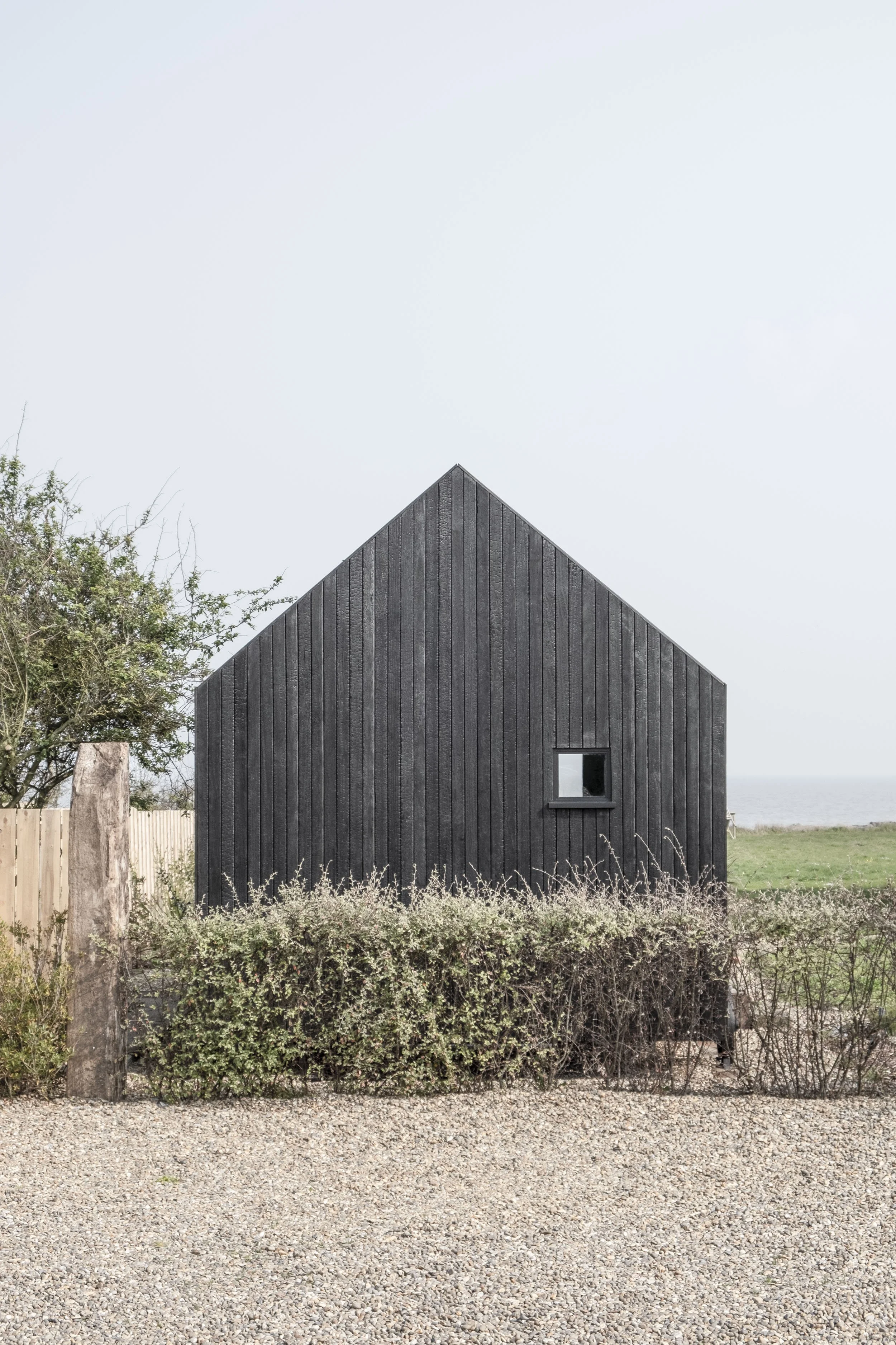 Inclume LTD — Black timber cabin in contemporary style