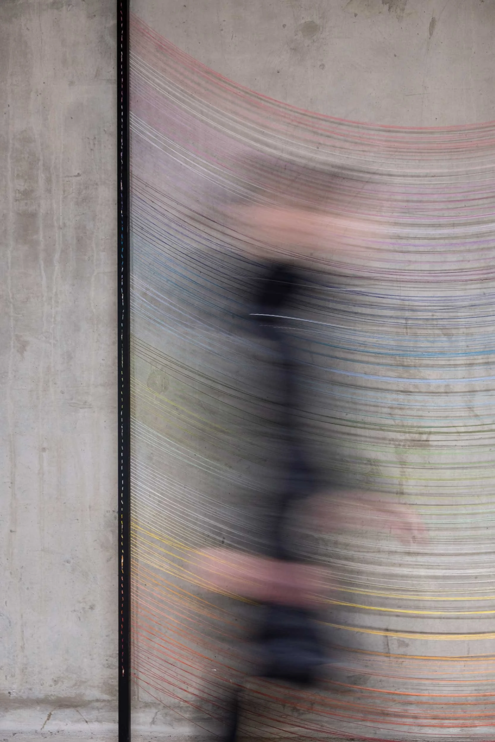 Person walking past the artwork