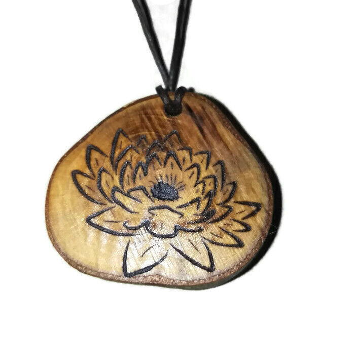 Add a touch of nature to your jewellery collection with this Water Lily Flower Pendant Charm. Handmade and engraved on beautiful Retrosheep wood, it's a unique piece that will elevate any outfit. Personalise it with your own engraving and make it tru