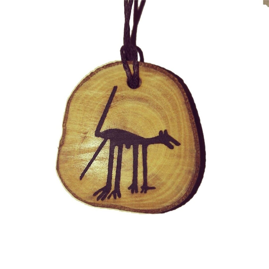 Discover the mystery of the ancient Nazca Lines with this Dog Geoglyph Engraved Personalised Necklace by Retrosheep! Handmade in Great Britain with natural wood, this pendant is cut to size and can be personalised. Perfect for dog lovers and Ancient 