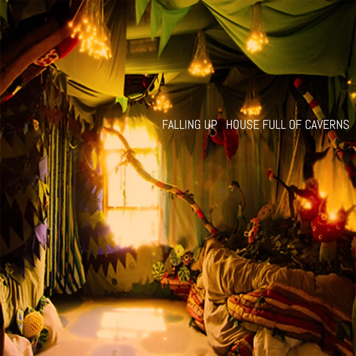 Cover art for House Full of Caverns by Falling Up and composed by Jessy Ribordy, showcasing eerie, labyrinthine imagery that complements the album’s experimental, ambient soundscapes with deep, immersive melodies and a sense of mystery.
