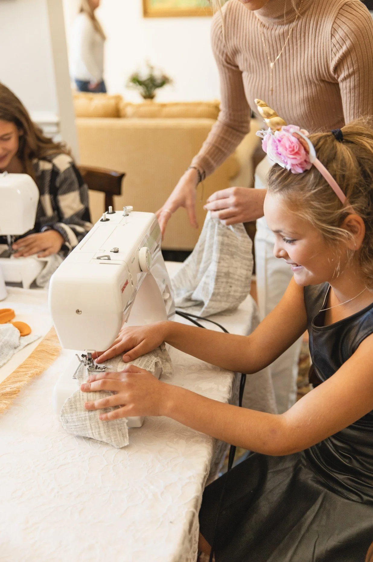 Girl and Teacher Sewing.jpg