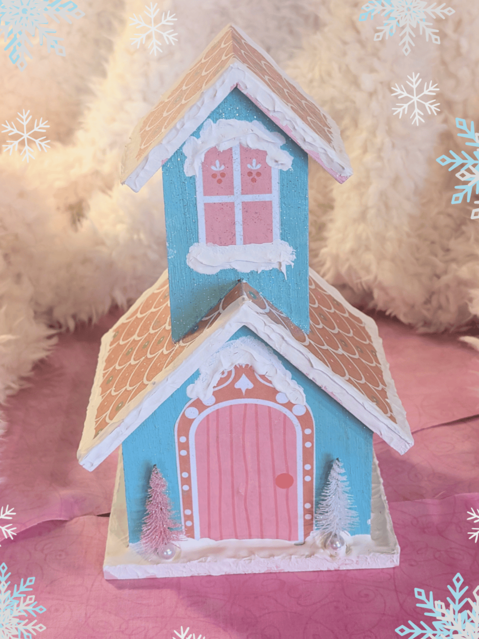 Blue and pink wooden gingerbread house