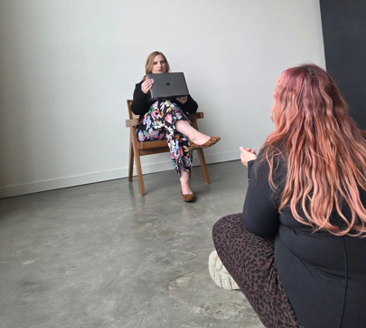 Buzzmate Marketing Owner Melissa Vanderfluit being coached by Photographer Sofia Katherine