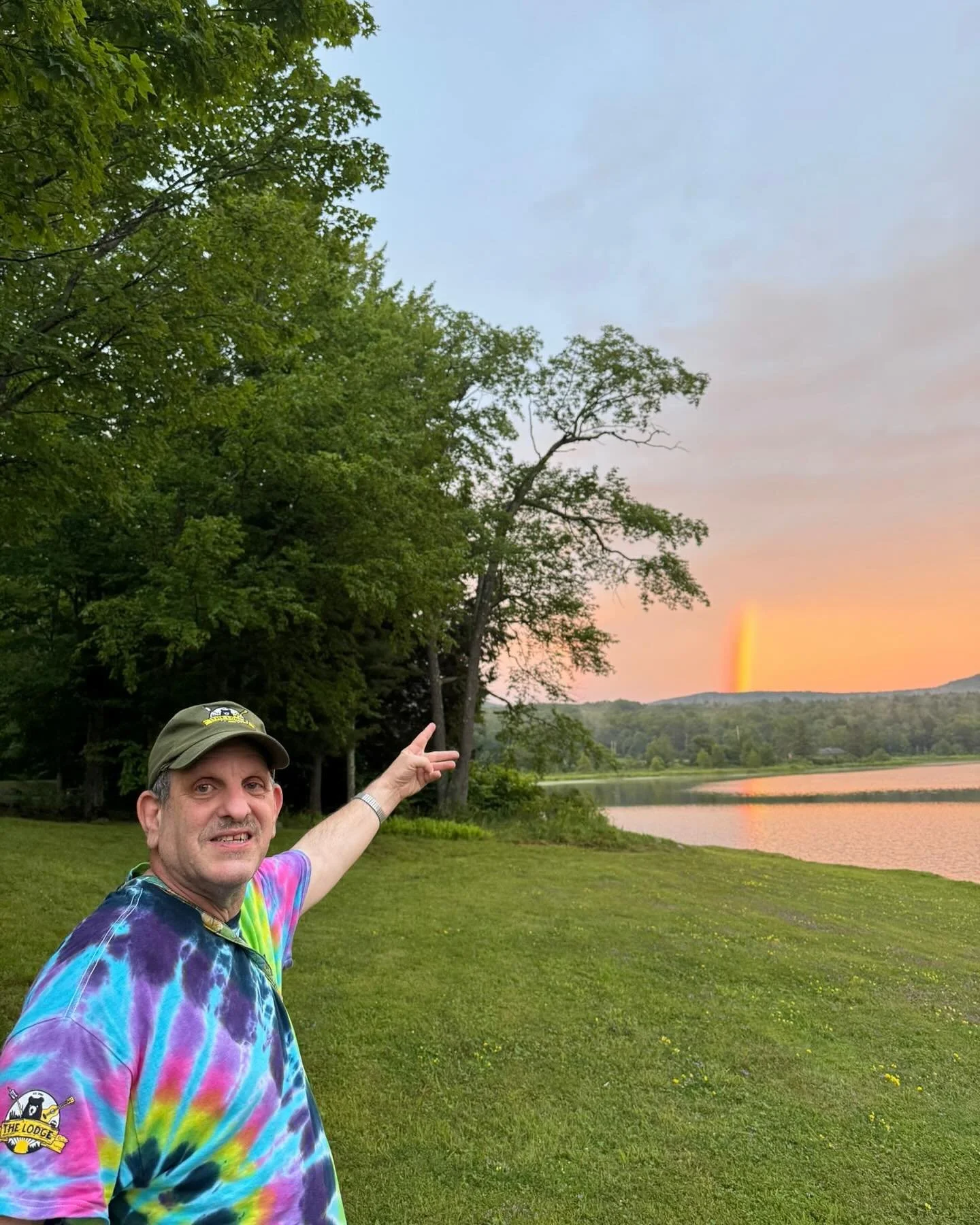 Our beautiful lake featuring Evan Miller in our Unbearables t-shirt 🌈🐻