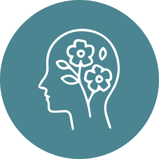 Outline of a human head in profile with flowers inside, representing mental health or mindfulness.