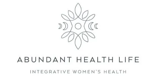 Logo featuring a symmetrical floral design with the text 'ABUNDANT HEALTH LIFE' and 'INTEGRATIVE WOMEN'S HEALTH'.