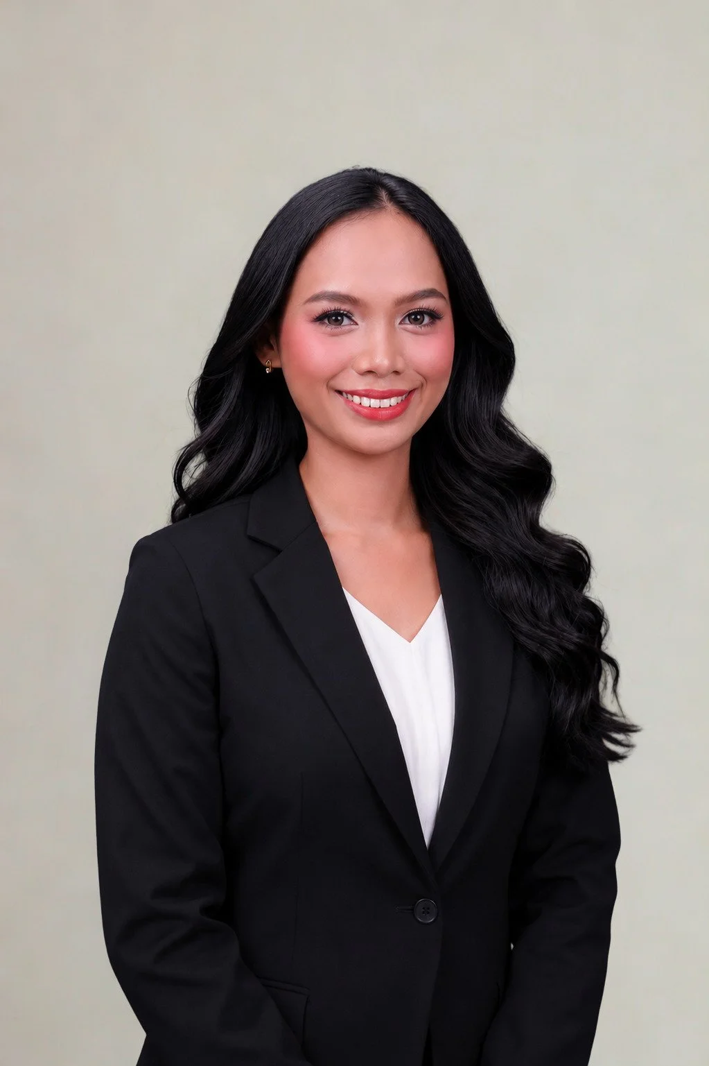 Woman in black suit smiling