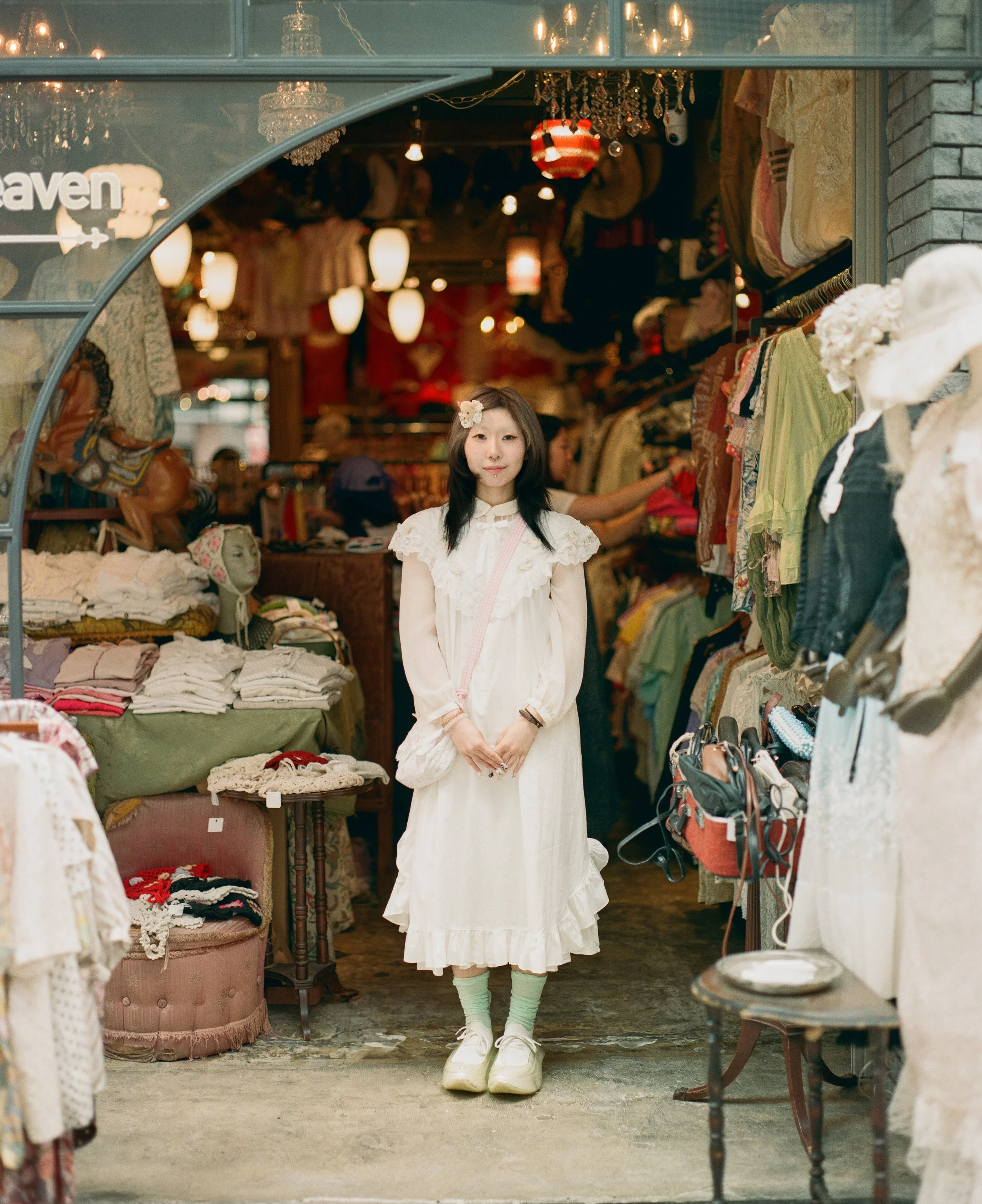 Koenji, like Shimo-Kitzawa, turned out to be full of interesting people with very individual styles. This was especially so for people working at clothing stores. This young woman was especially kind to come out into the light from the shop behind an