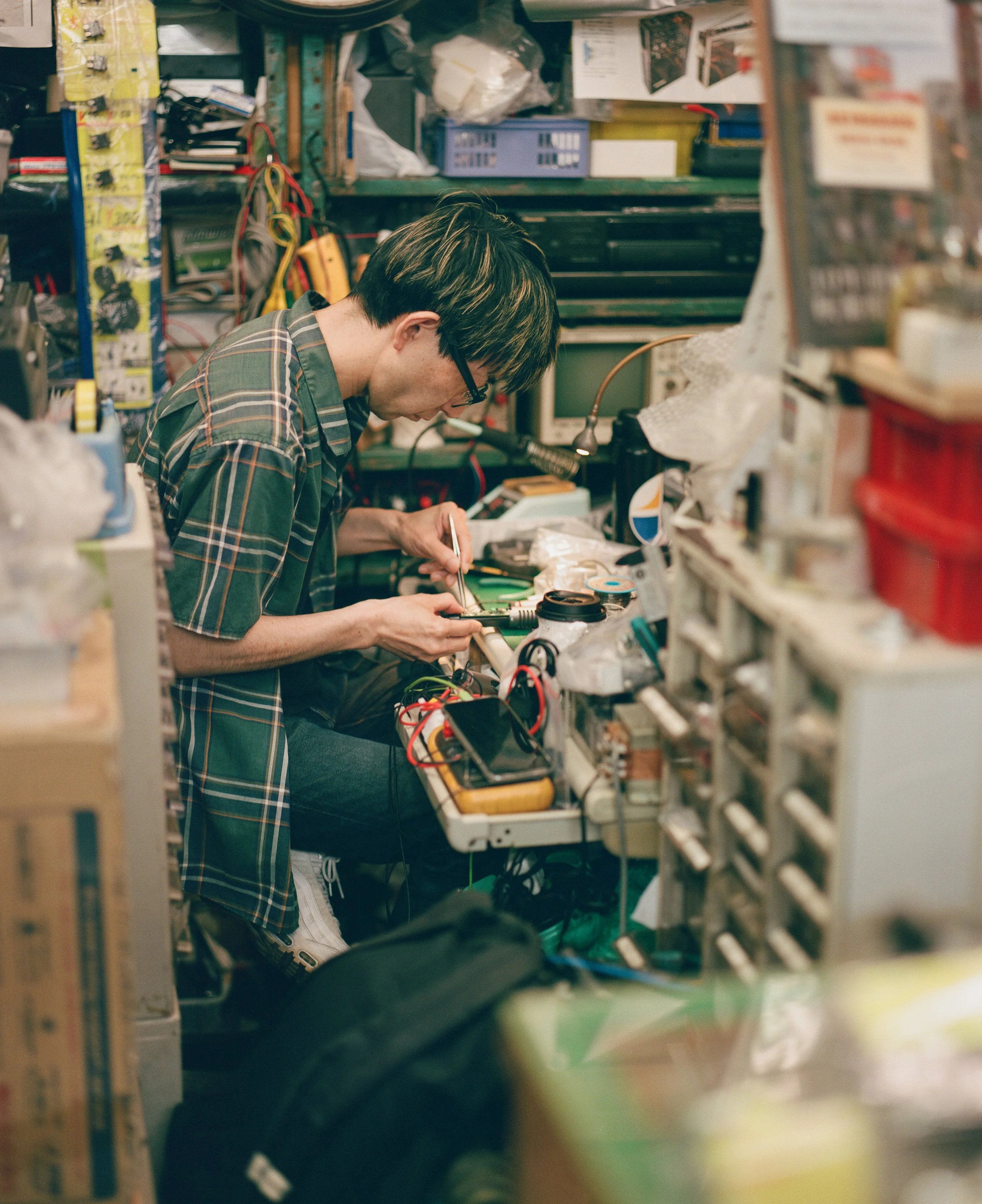 Man repairing an audio component at his shop in one of the electronics-dedicated buildings in Akihabara. We chatted. He was excited to tell me he has been to London, and the one place he mentioned was Battersea.
