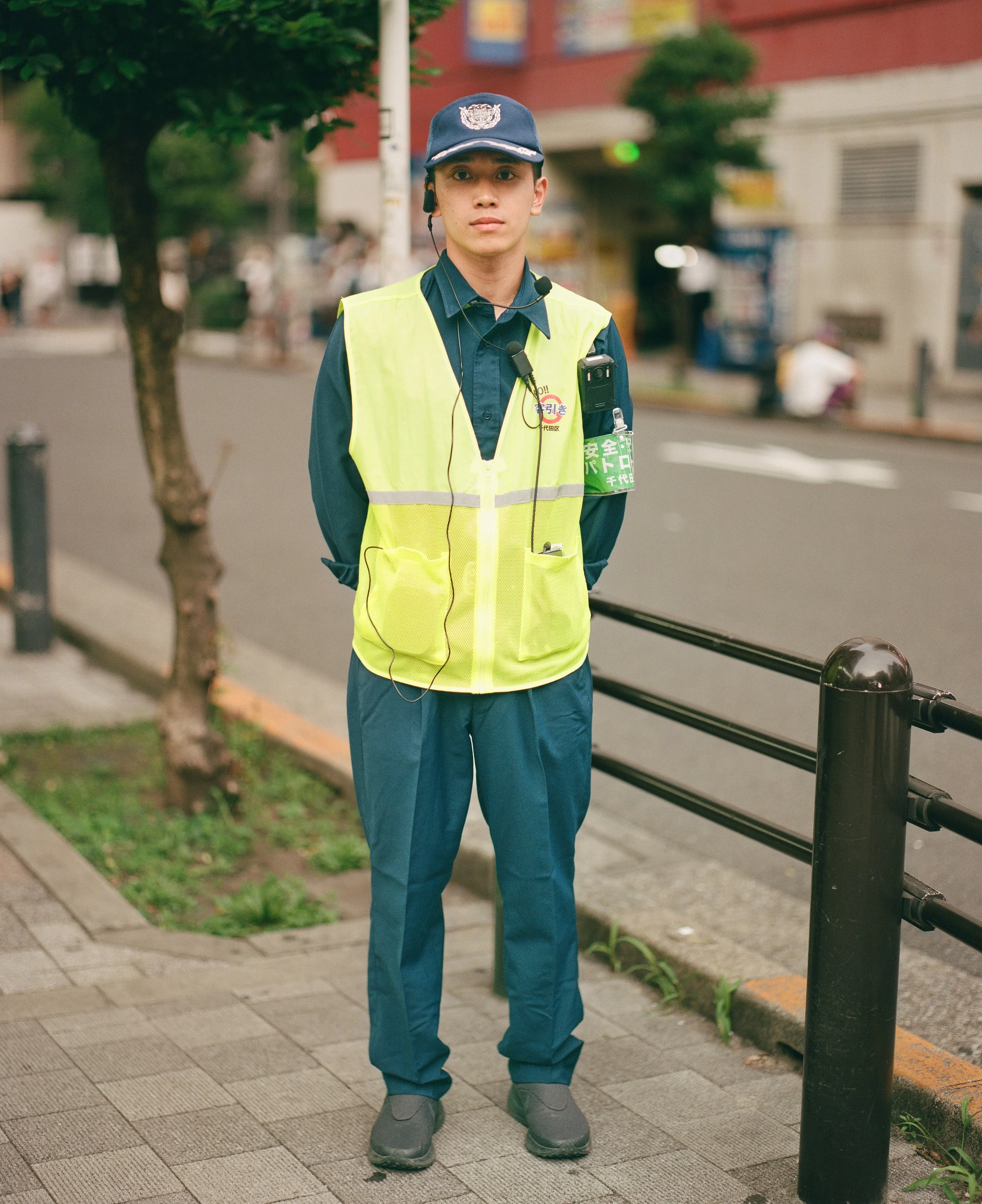 Ryuga, a security guard helping with crowd control and keeping people away from street promoters in Akihabara.