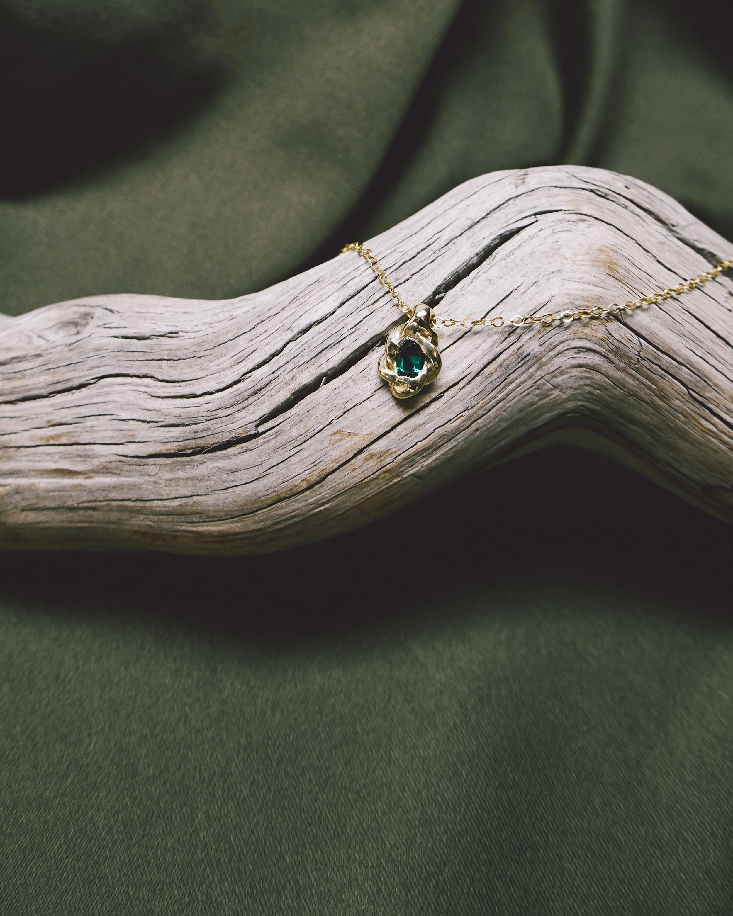 BraidedPendant-Emerald1.jpg