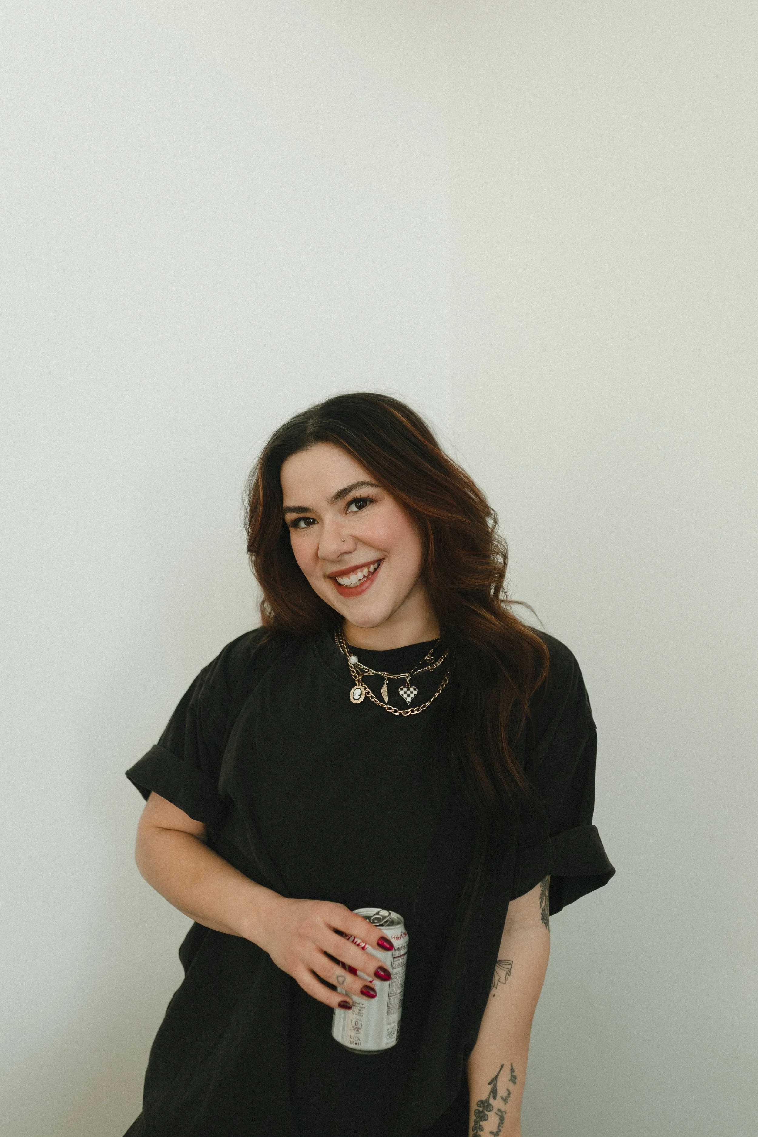 Alaska boudoir photographer smiles with diet coke