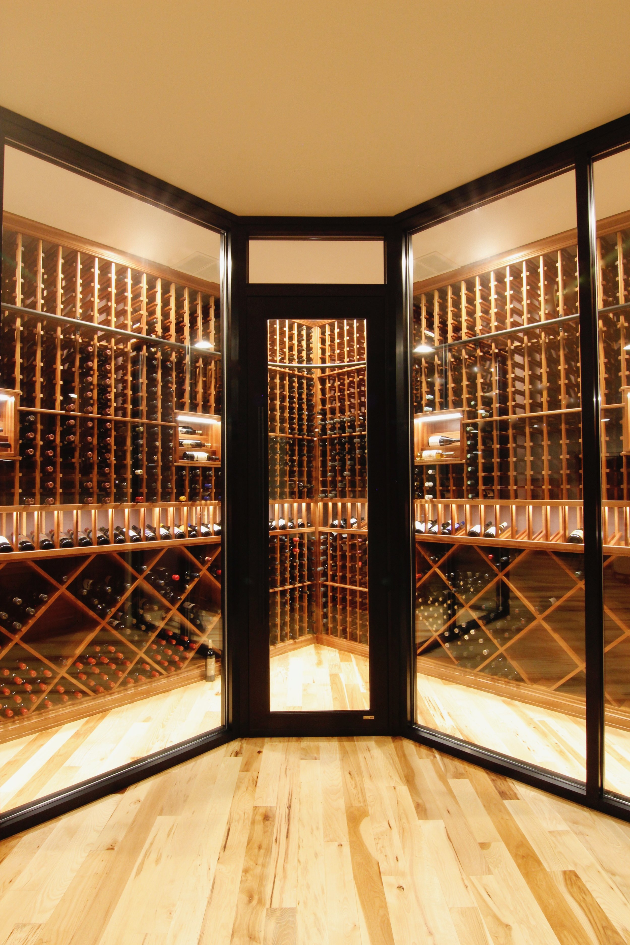 seattle_bellevue_woodinville_custom_custom_wine_cellar_design_sapele_ducted_cooling_rolling_ladder_glass_enclosure_4-1.jpg