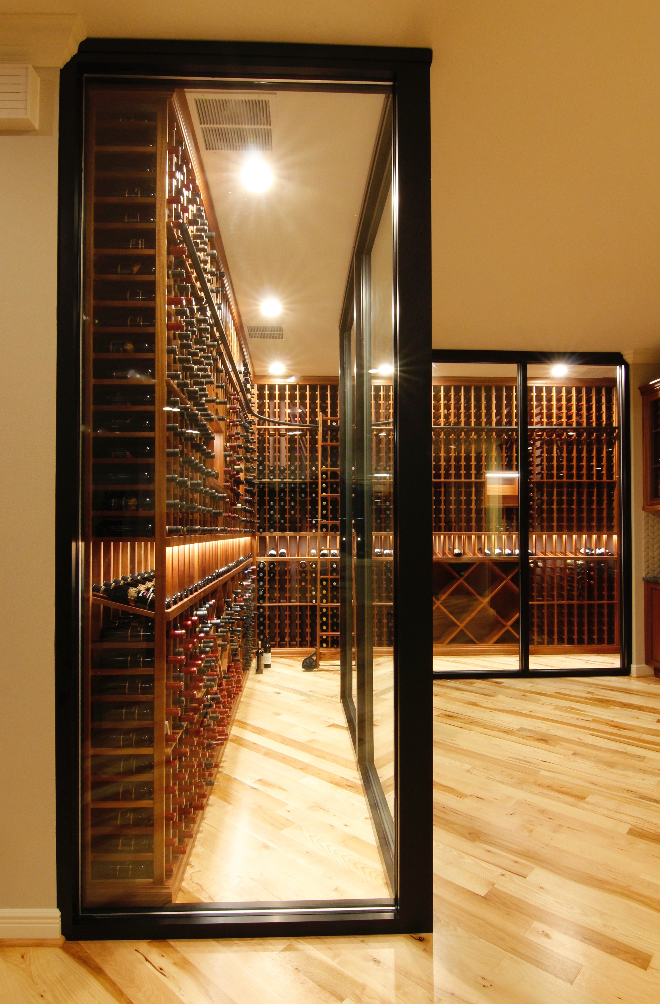 seattle_bellevue_woodinville_custom_custom_wine_cellar_design_sapele_ducted_cooling_rolling_ladder_glass_enclosure_3.jpg