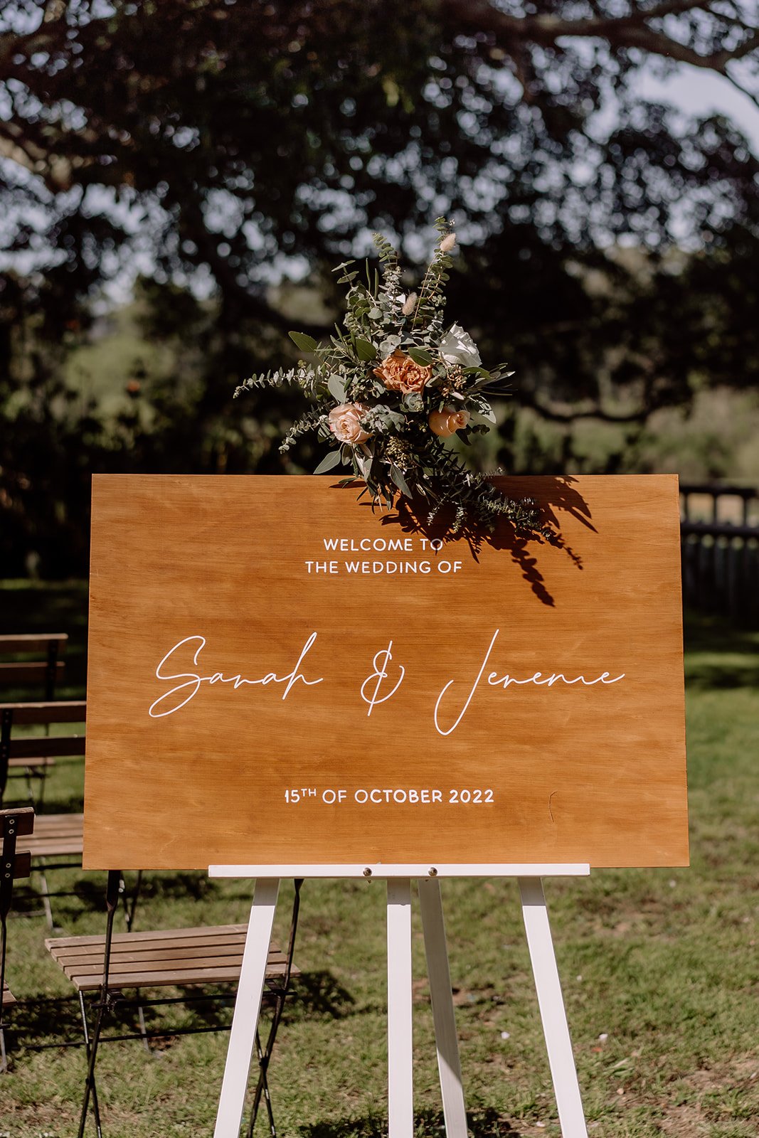 Wooden wedding signage with hanging florals at Tocal Homestead