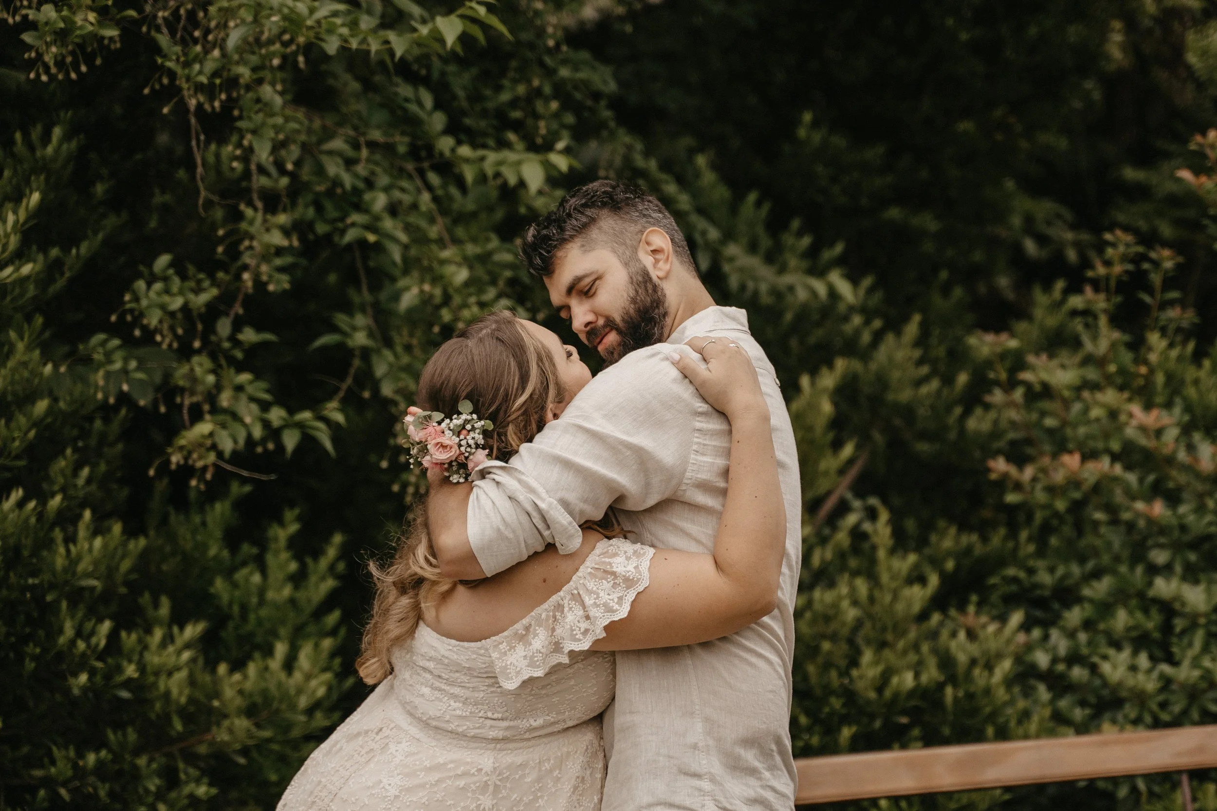 Bride and groom share first kiss at wedding at Paradise Botanical Gardens