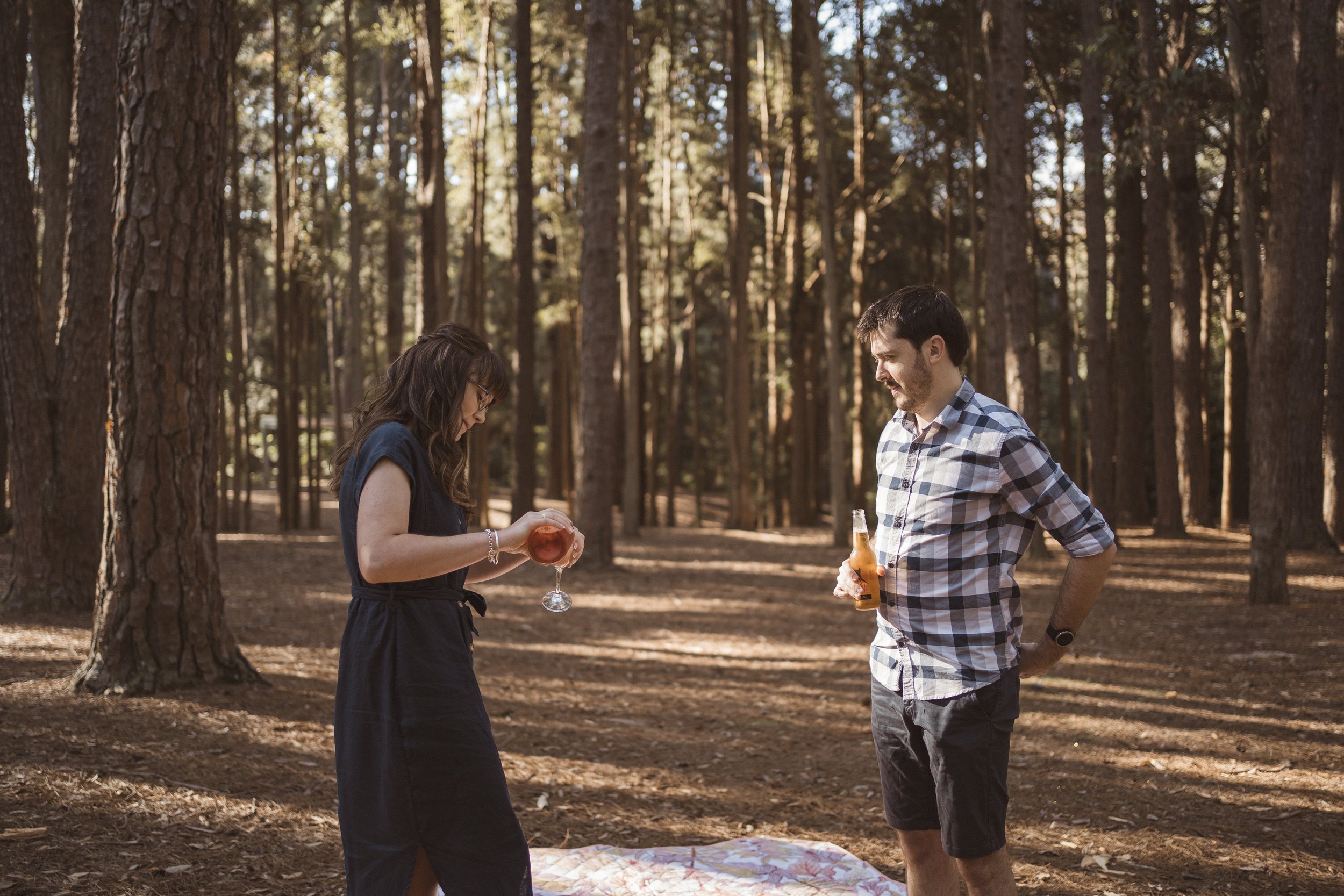 A couple during their engagement shoot in the serene pine forests of The Watagans.