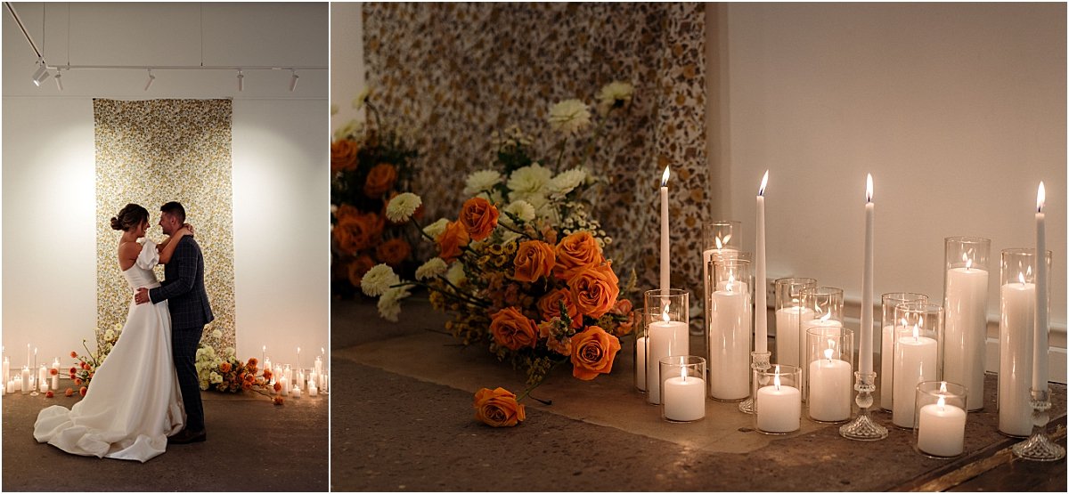 Bride and groom dancing together in front of retro fabric, pillar candles and orange and yellow floral nest